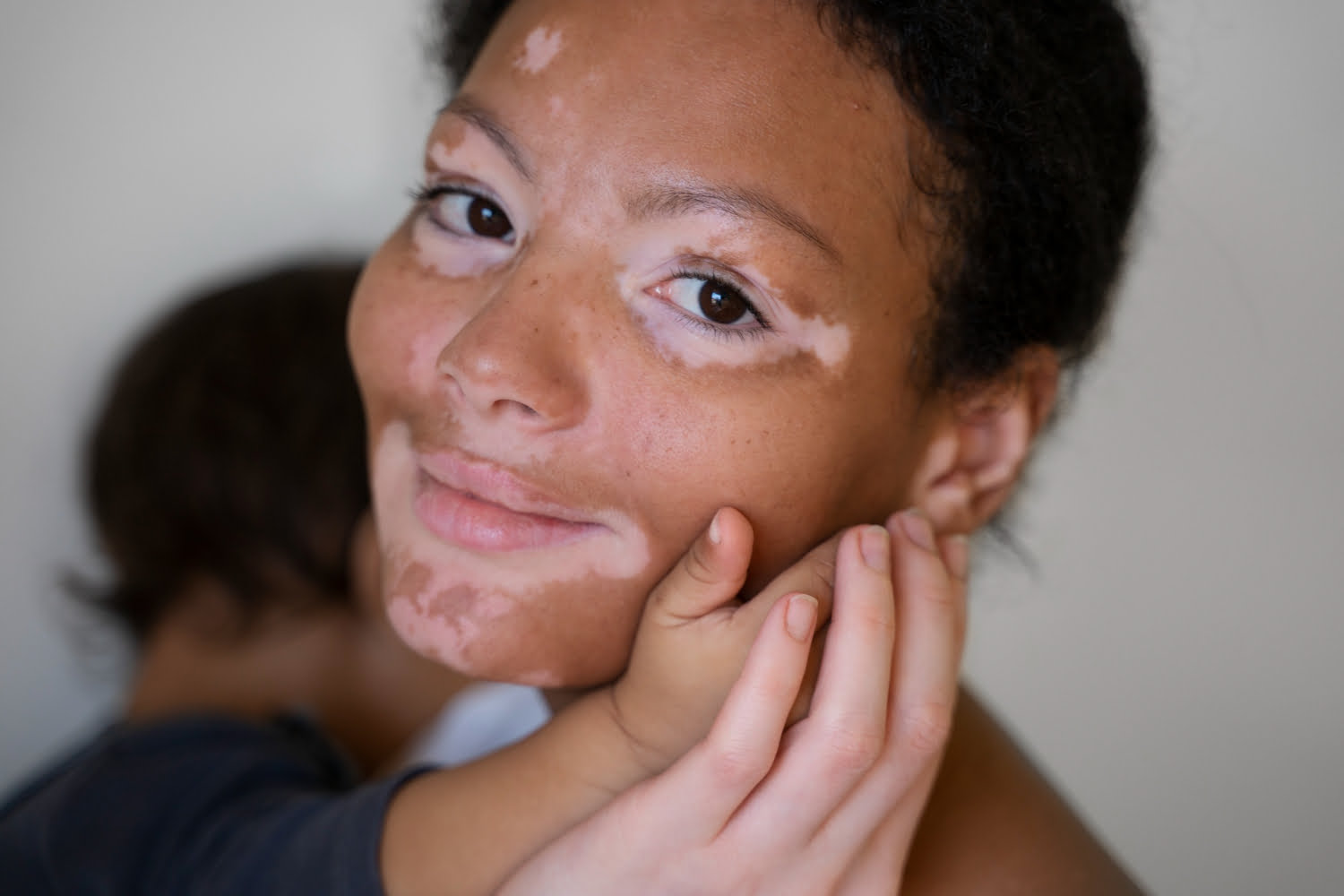 Misaki skincare products featured in a tender moment between a mother and child.